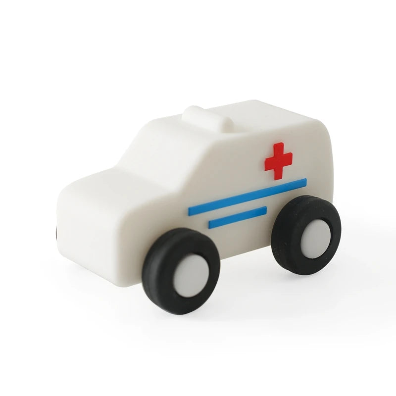 White ambulance baby teething toy made of natural rubber for soothing relief.