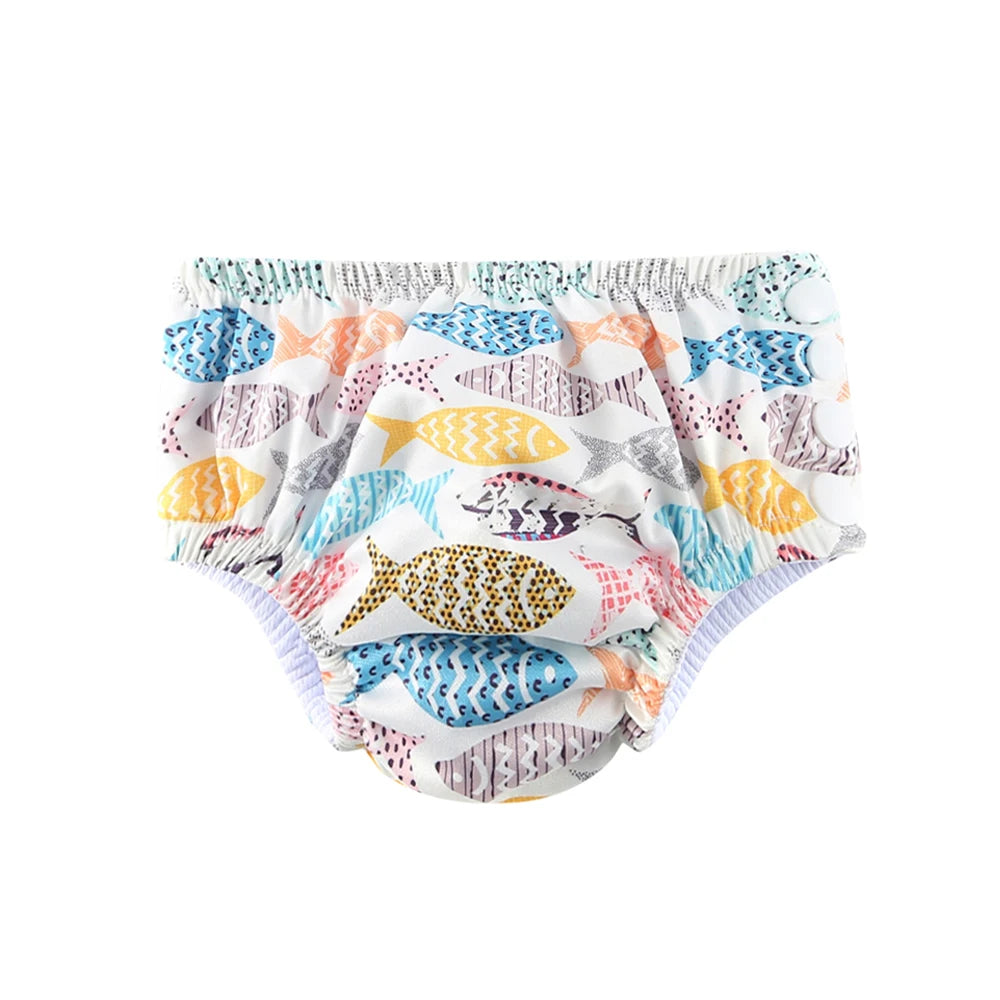 Reusable swim diaper with colorful fish print, snap-side baby care essential for infants.