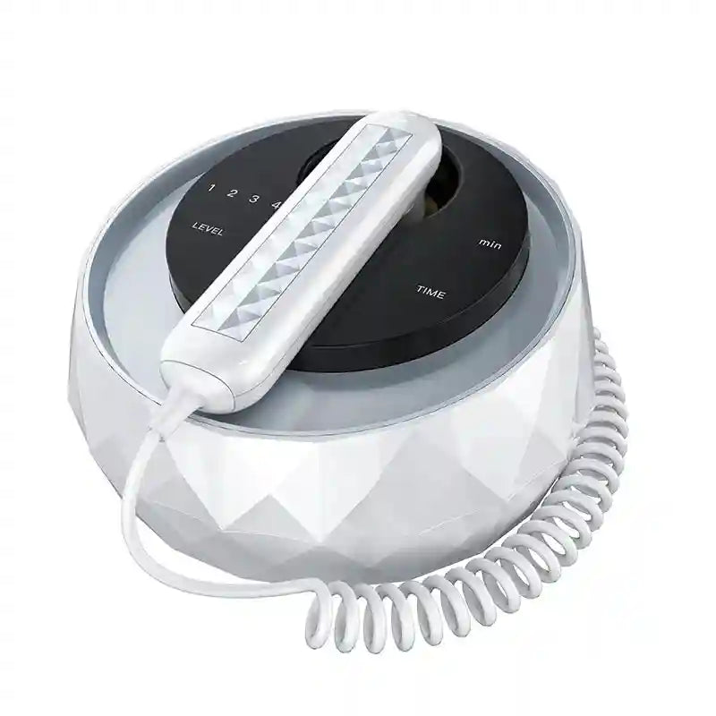 White, faceted, round facial lifting device with a black control panel and handheld probe on a coiled cord.