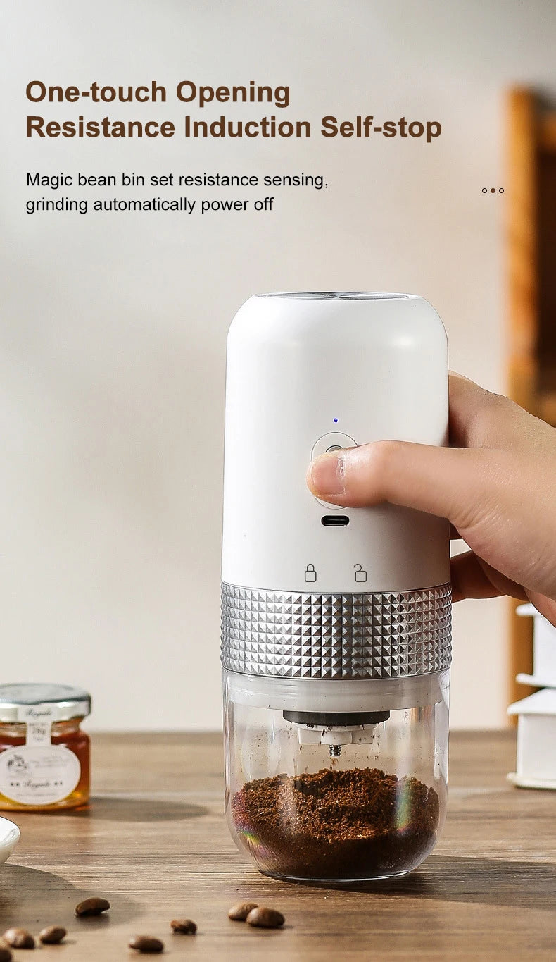 Compact white portable electric coffee grinder with clear bean bin and one-touch auto-stop sensor feature.