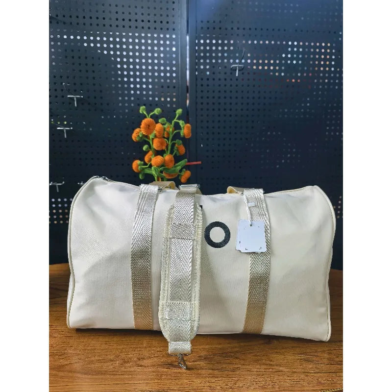 Waterproof yoga gym crossbody bag in white with silver straps and front O-detail
