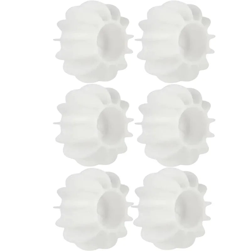 White reusable silicone laundry balls for removing pet hair and cat fur in the washing machine.