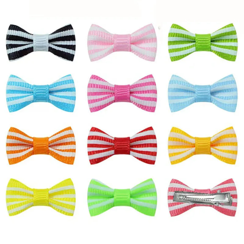 Colorful striped bow hair clips for small dog and cat grooming. Durable ribbon barrettes for cute pet styling.