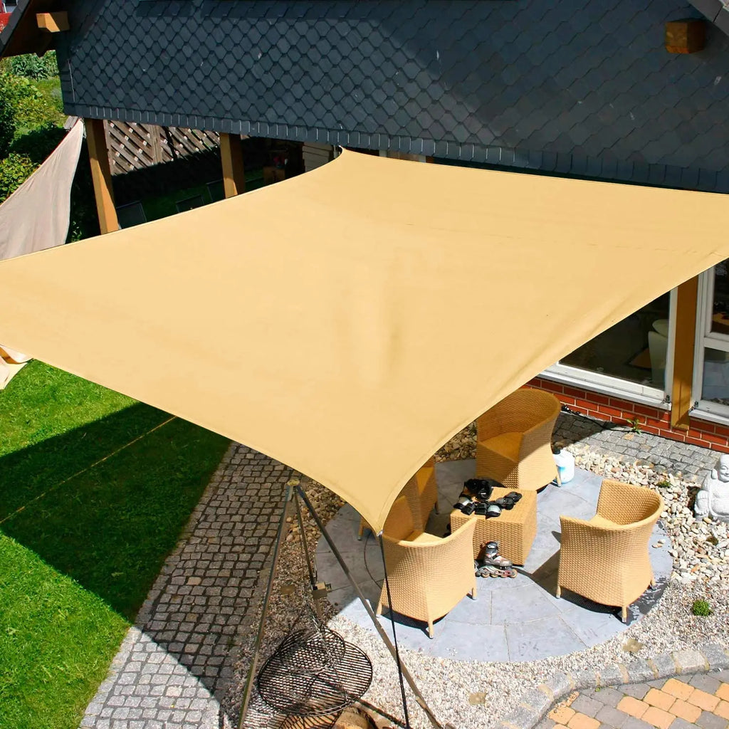 Beige waterproof rectangle sun shade sail canopy over a patio with corner grommets
