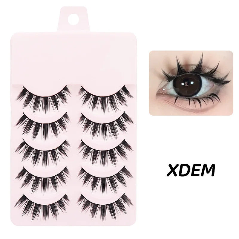 Five pairs of wispy black false eyelashes on a pink tray, shown applied to upper and lower lash lines.