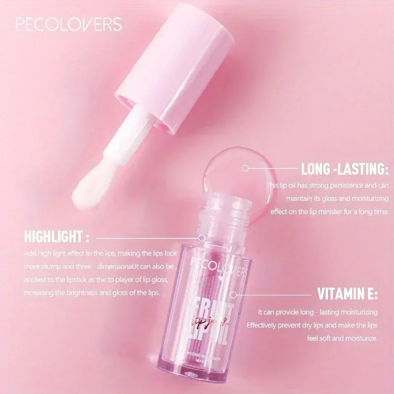 Transparent moisturizing glass lip oil with plumping effect and applicator on pink background.