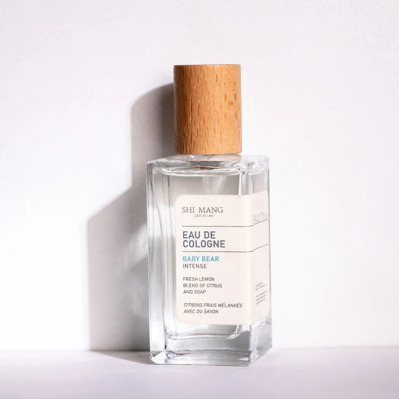 Shi Mang Baby Bear Eau de Cologne: 50ml women's citrus lemon woody fragrance in a square glass bottle with wood cap.