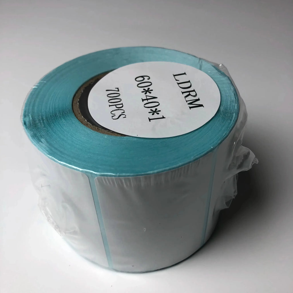 Thermal label sticker roll in plastic wrap with teal outer edge