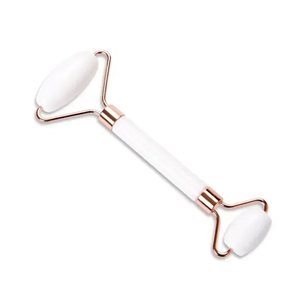 White resin facial jade roller with rose gold frame for anti-aging, wrinkle reduction, and face lifting massage.