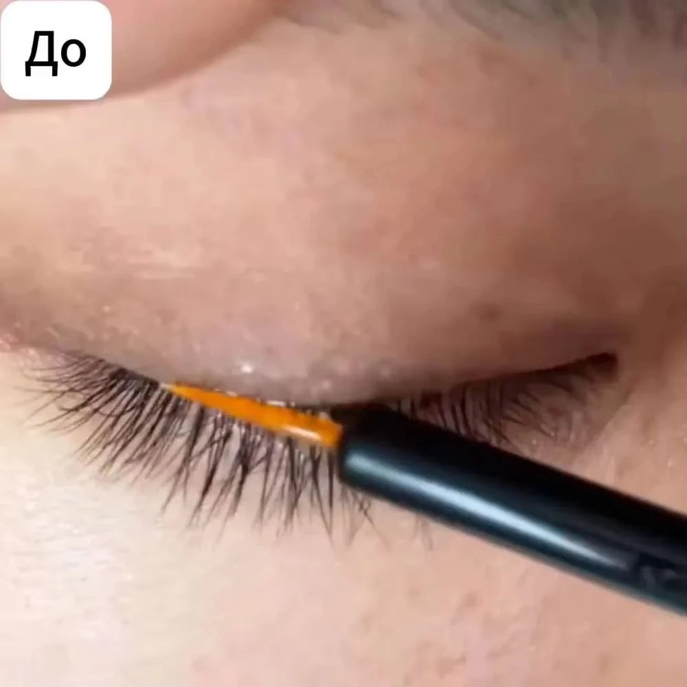 Applying 2-in-1 eyebrow and eyelash growth serum with a fine-tip applicator for thicker, longer, natural lashes.