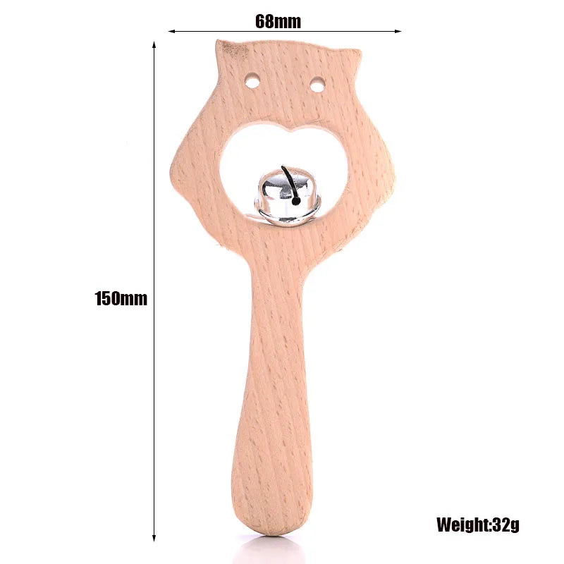 Natural wood owl baby teething toy with bell for soothing teething pain, light beige color.