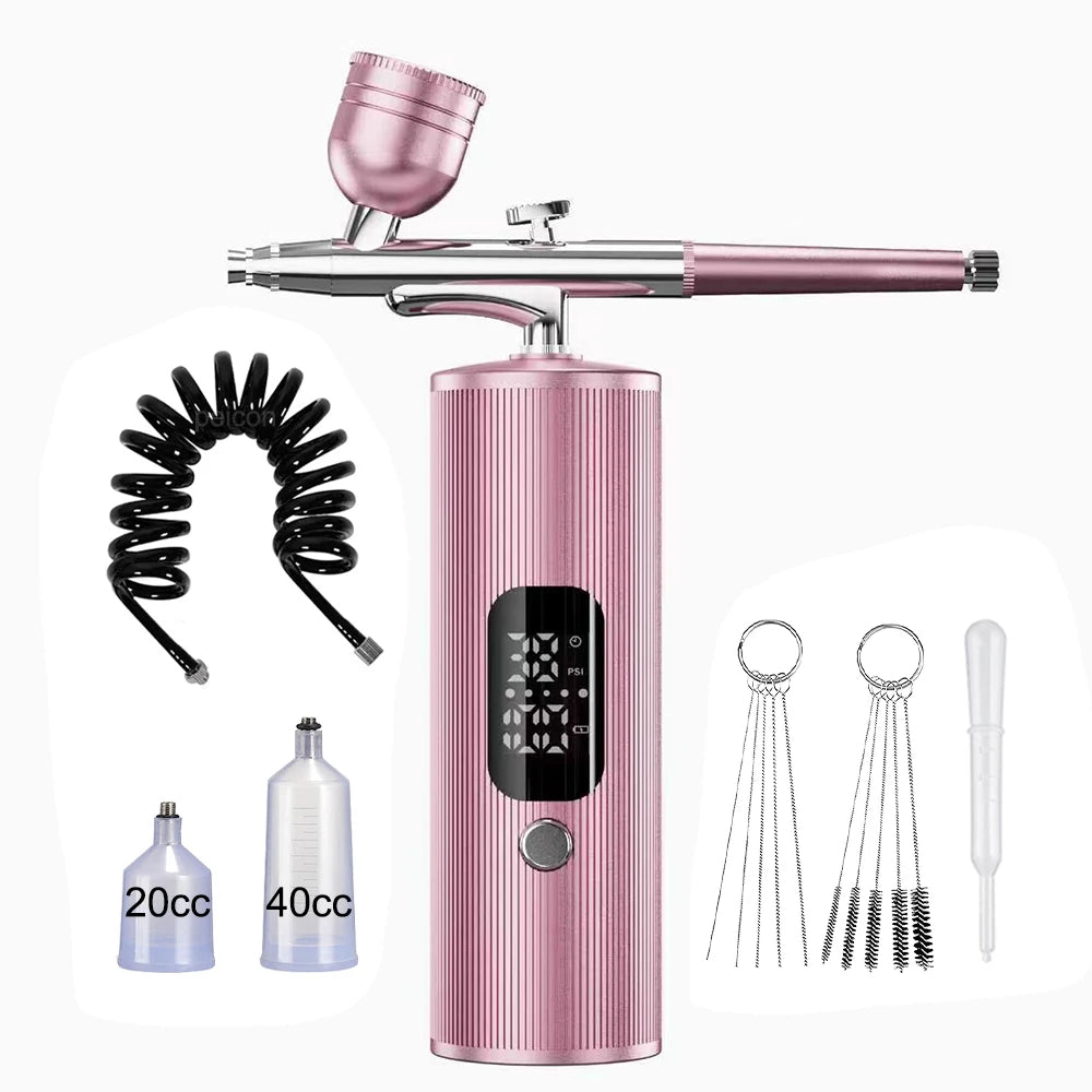 Portable pink cordless airbrush kit for nail art, makeup, and cake decorating with digital display and cup set.