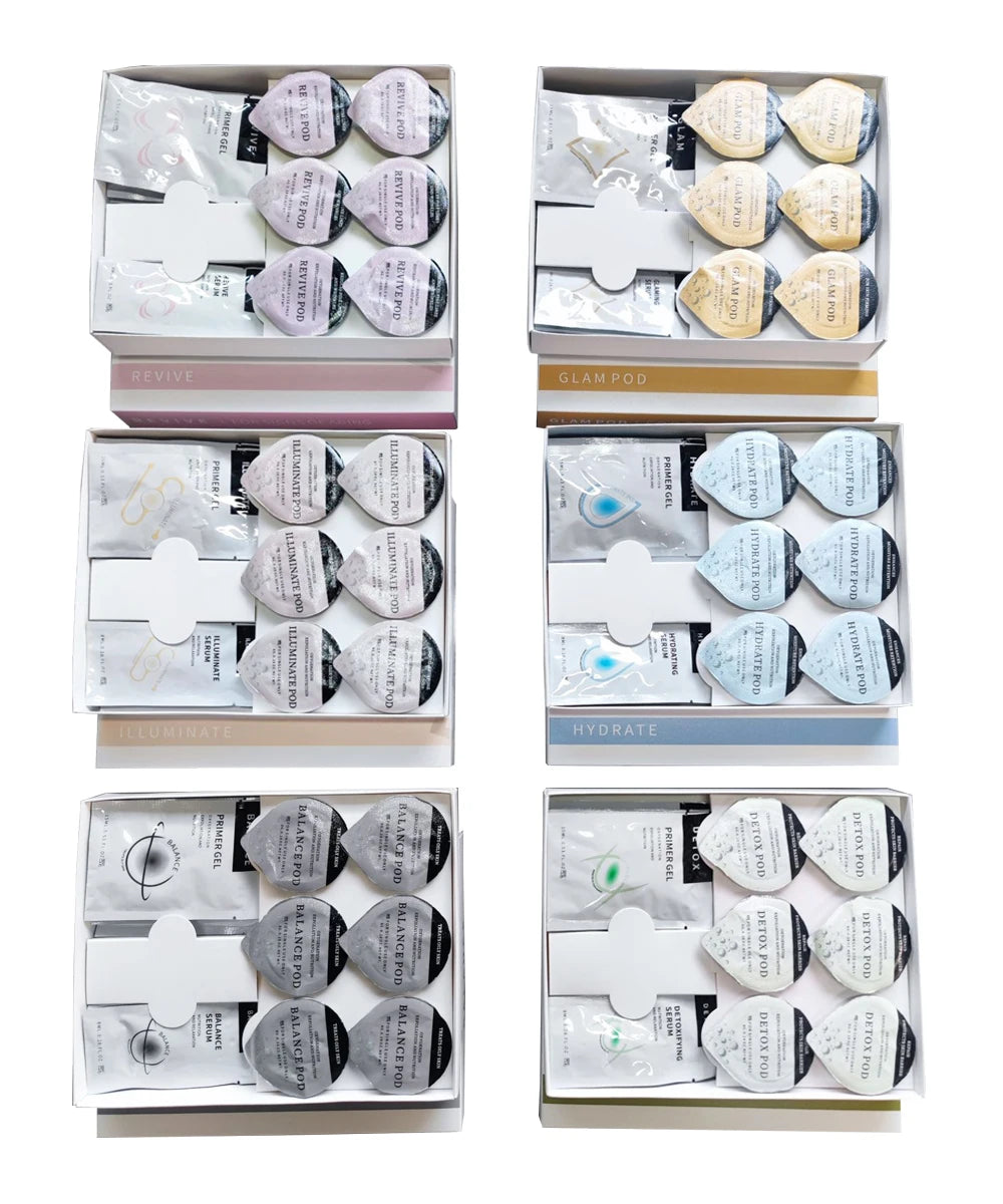 Six boxes containing various spa capsule facial treatment sets, each with matching serum pouches and pod applicators.