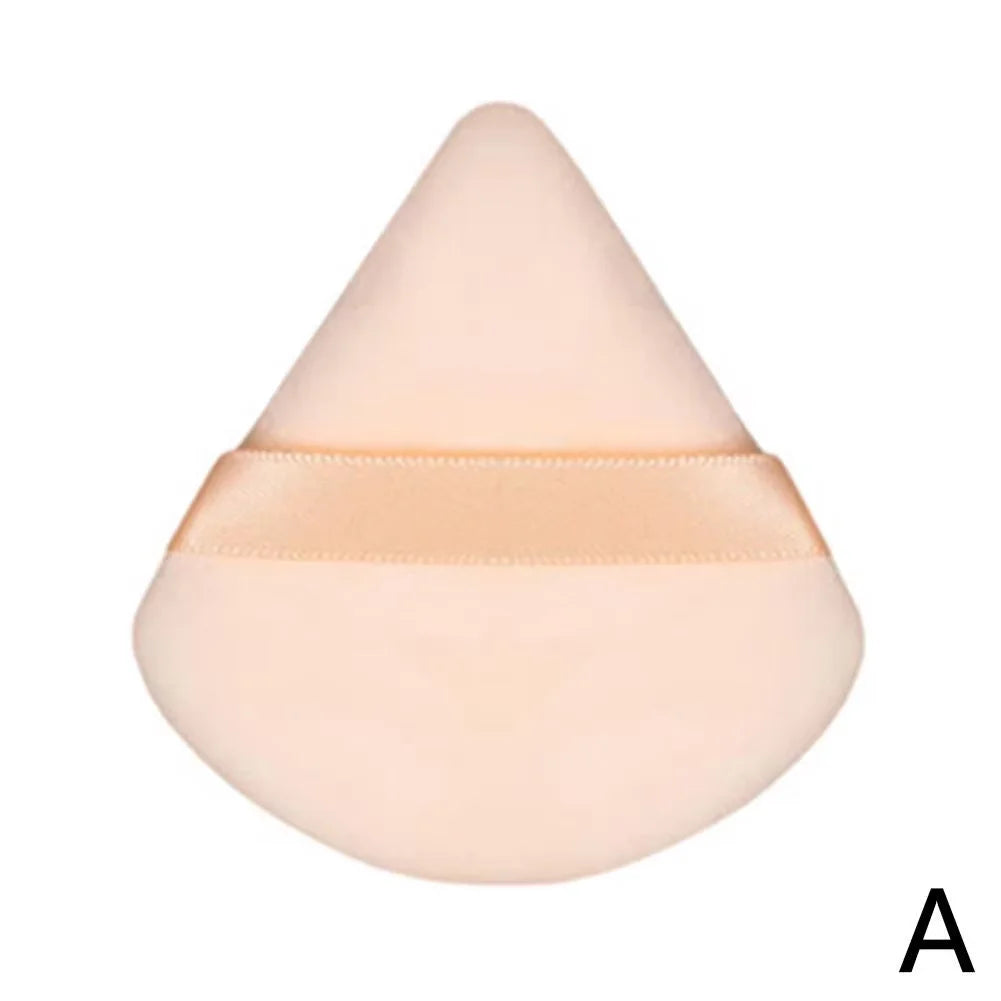 Peach-colored cream texture swatch in a teardrop shape