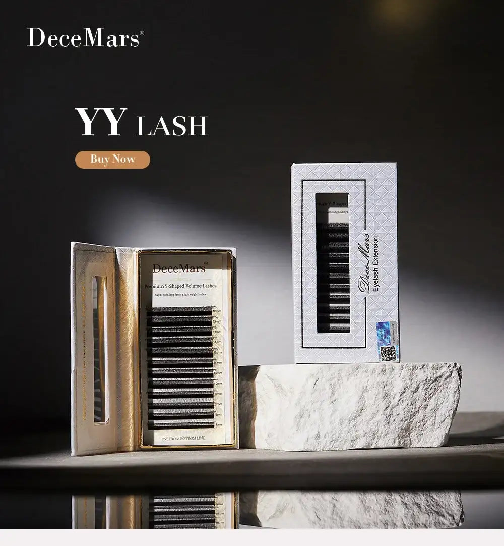 DeceMars black YY-shaped volume eyelash extension trays in white boxes displayed on a stone surface.