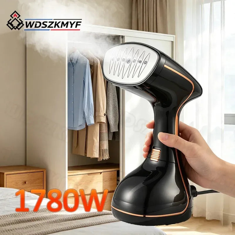 Handheld clothes steamer in glossy black releasing steam near hanging garments.
