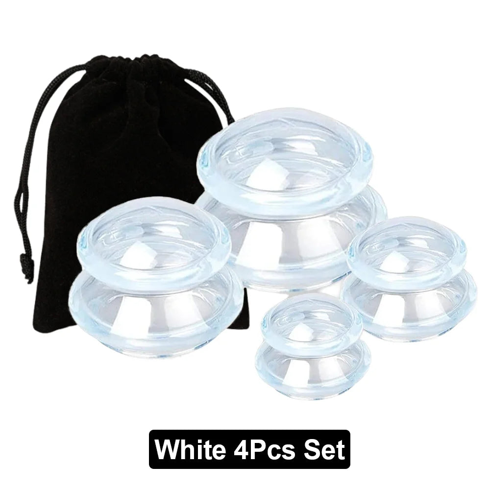 A set of four clear silicone vacuum massage cupping cups of varying sizes with a black velvet storage pouch.