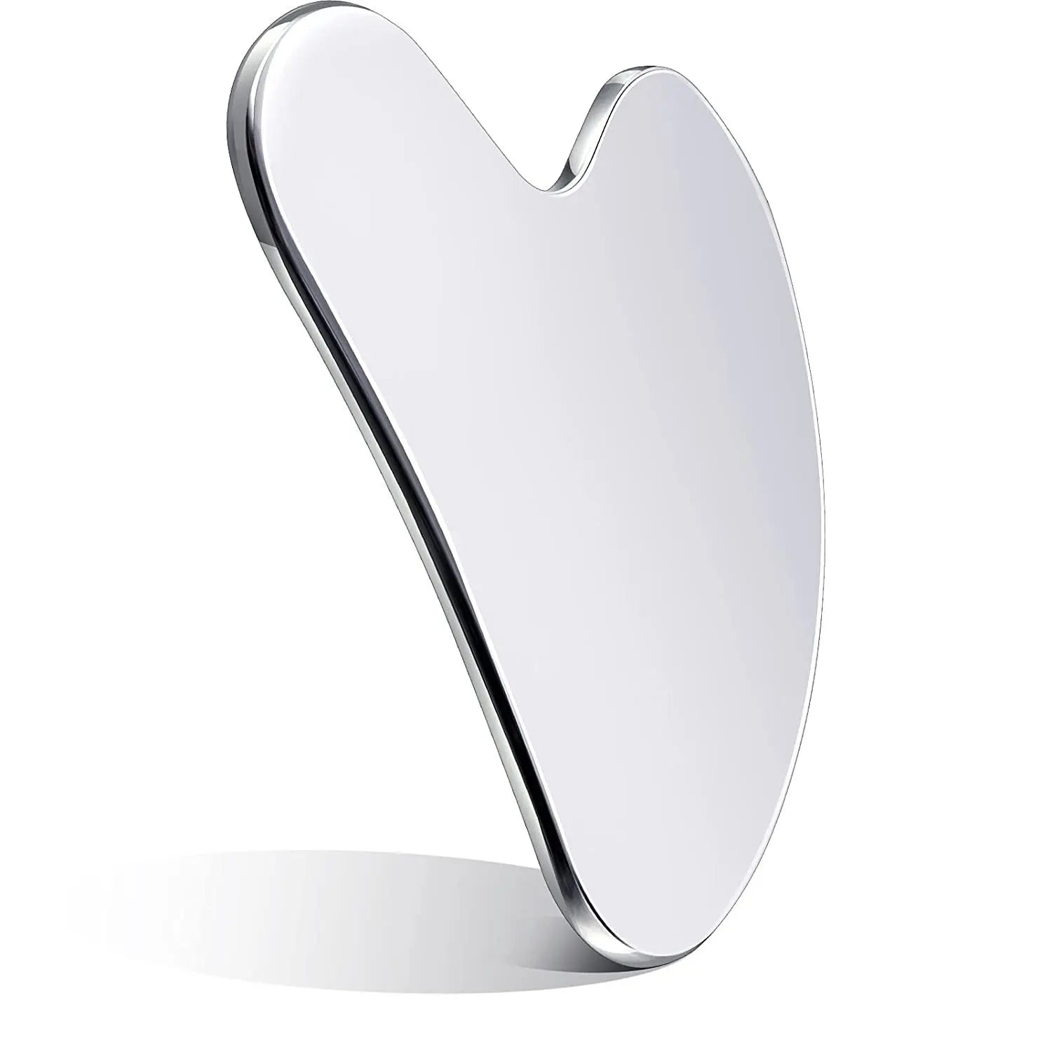 Heart-shaped, smooth, silver-metallic gua sha facial massage tool standing upright against a white background.