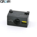 Barcode scanner module with black housing, round lens window, and yellow indicator
