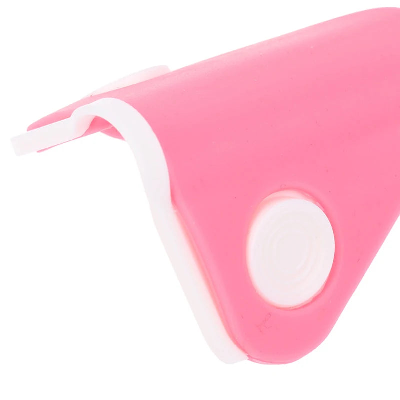 Pink silicone nose shaper clip, facial beauty tool for nose lifting, bridge straightening, and face lifting correction.