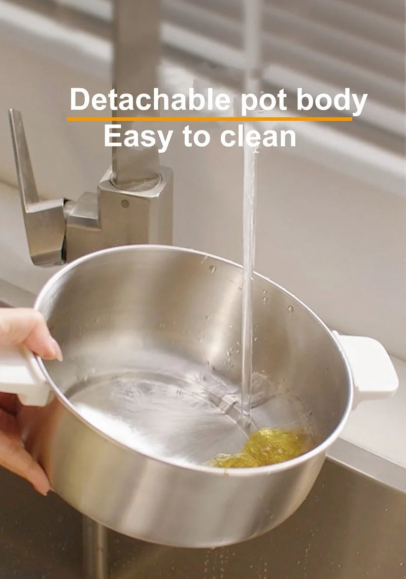 Detachable stainless inner pot of an electric hot pot being filled with liquid