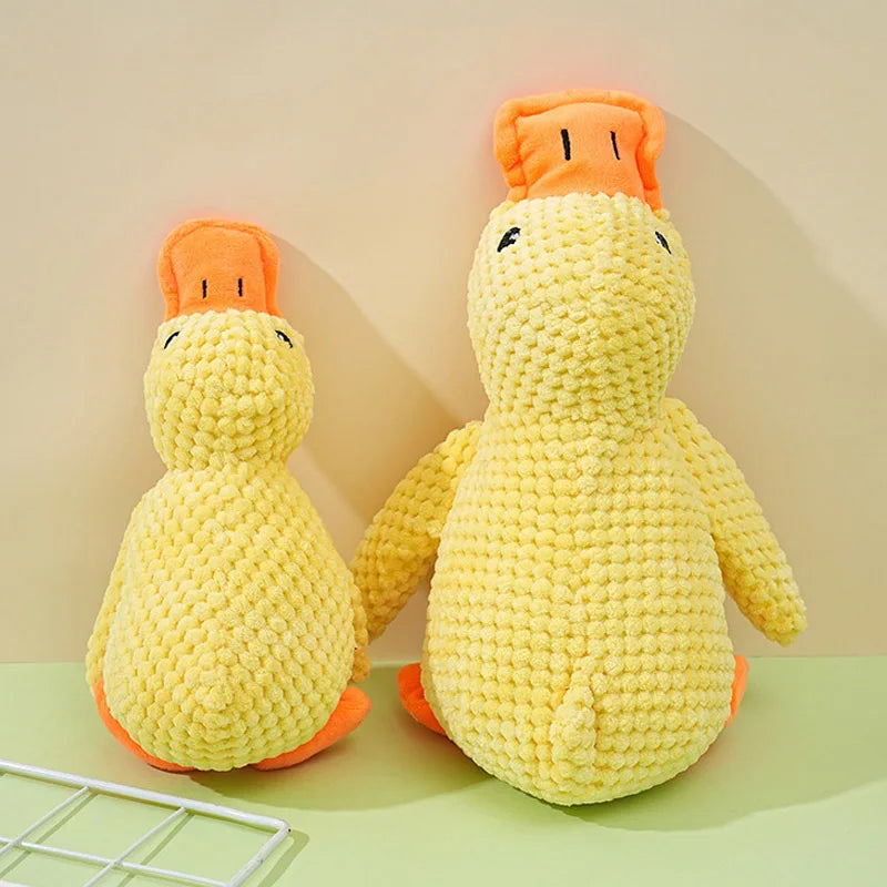 Bite-resistant yellow duck plush dog toy for interactive play and boredom relief. Soft textured chew toy for pets.