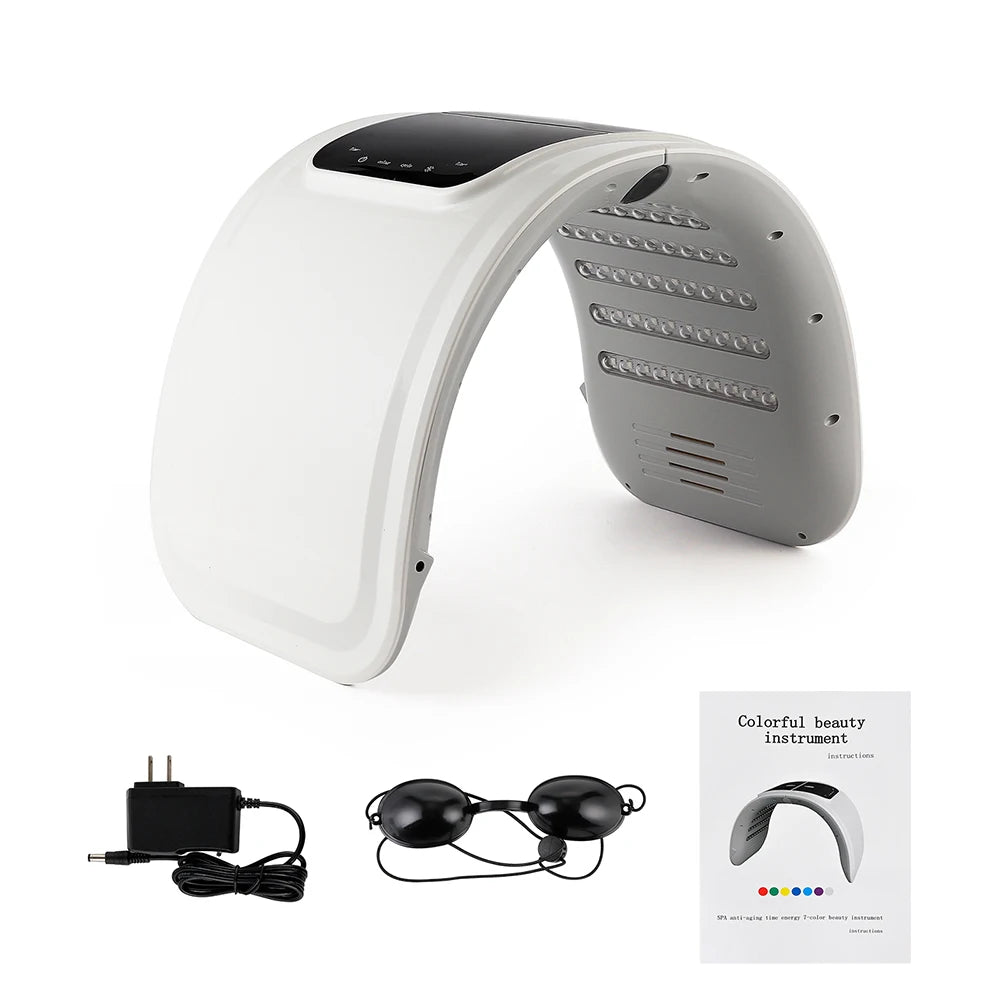 Arched LED light therapy device for facial skincare, with power cord, protective eye goggles, and instruction manual.