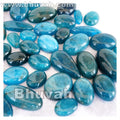 Ocean-blue cabochon gemstone assortment, oval cabochons scattered