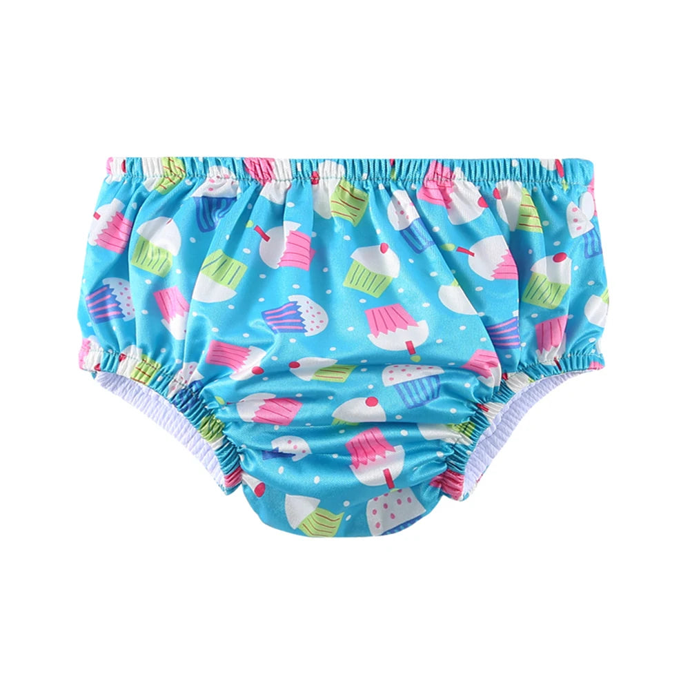 Baby care swim diaper in blue with cute colorful cupcake print for infants.