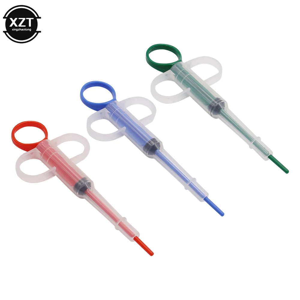 Set of colorful plastic pet medicine syringe feeders for easy tablet and liquid dosing for cats and dogs.