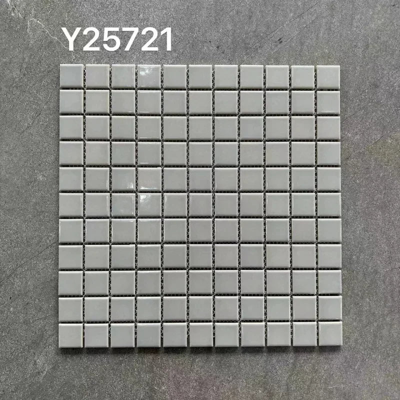 Ceramic mosaic tile sheet with small square white tiles on grid backing