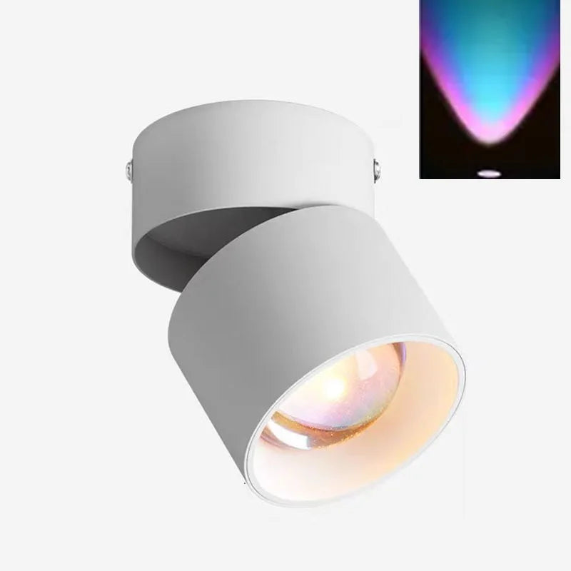 White LED ceiling surface spotlight with angled cylindrical head and colorful light beam