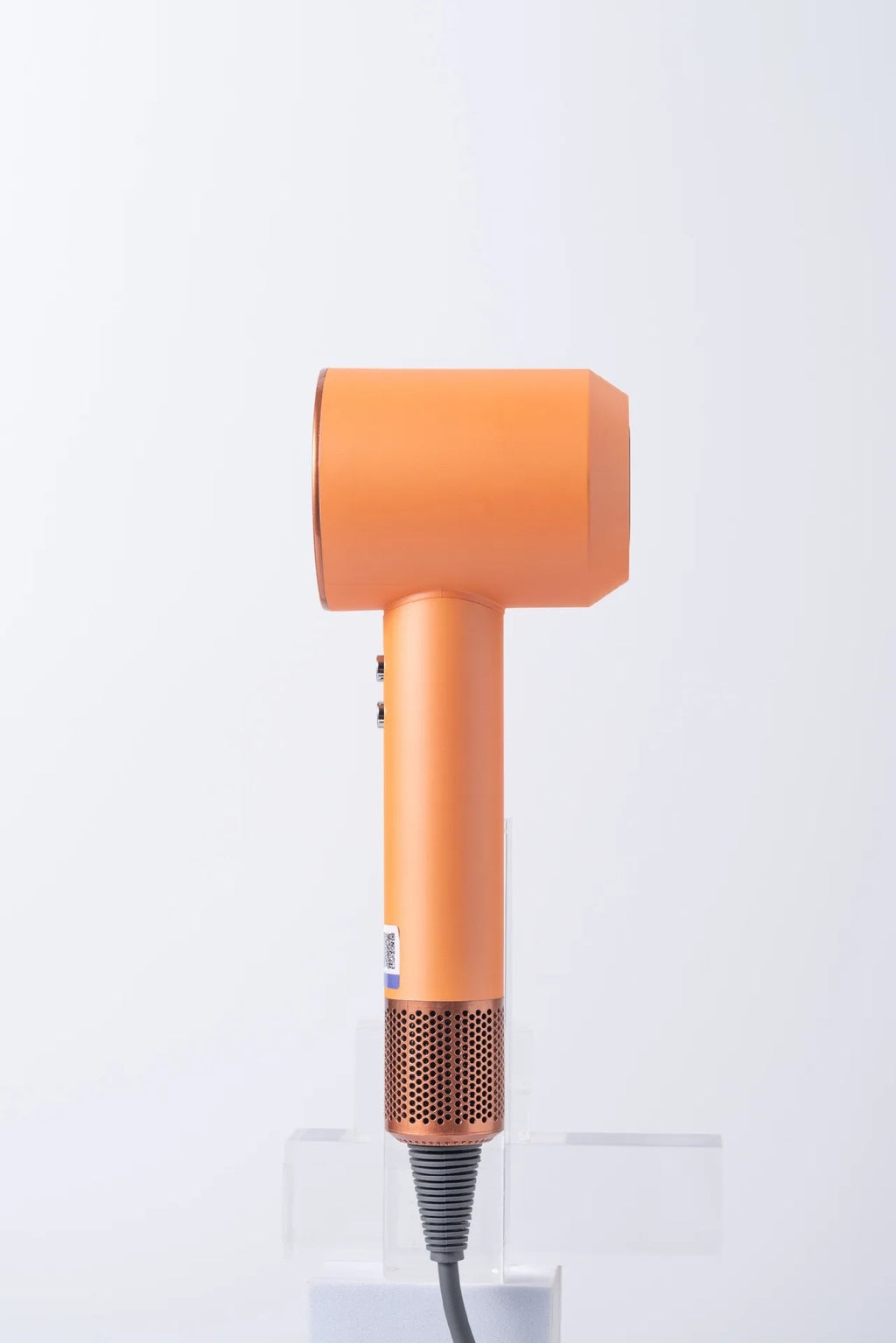 Orange high-speed negative ion bladeless hair dryer with a sleek hollow design and metallic gold base.