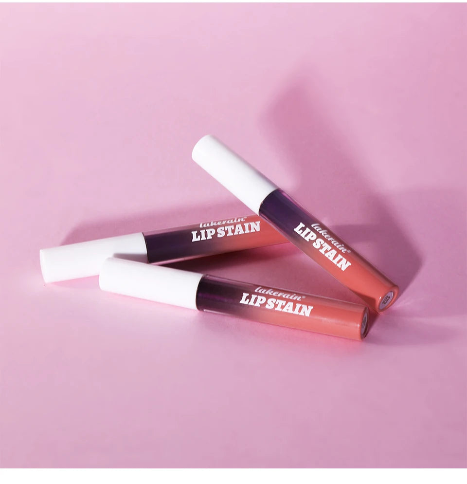 Lakerain waterproof peel-off lip stain tubes in nude pink on a soft pink background. Long-lasting matte lip makeup.