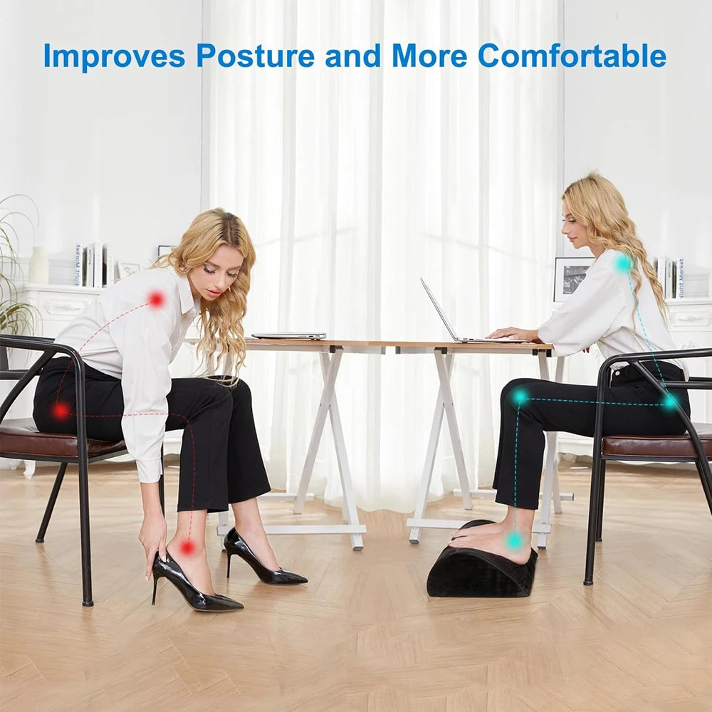 Black memory foam under desk foot rest improving posture and sitting comfort for office work.