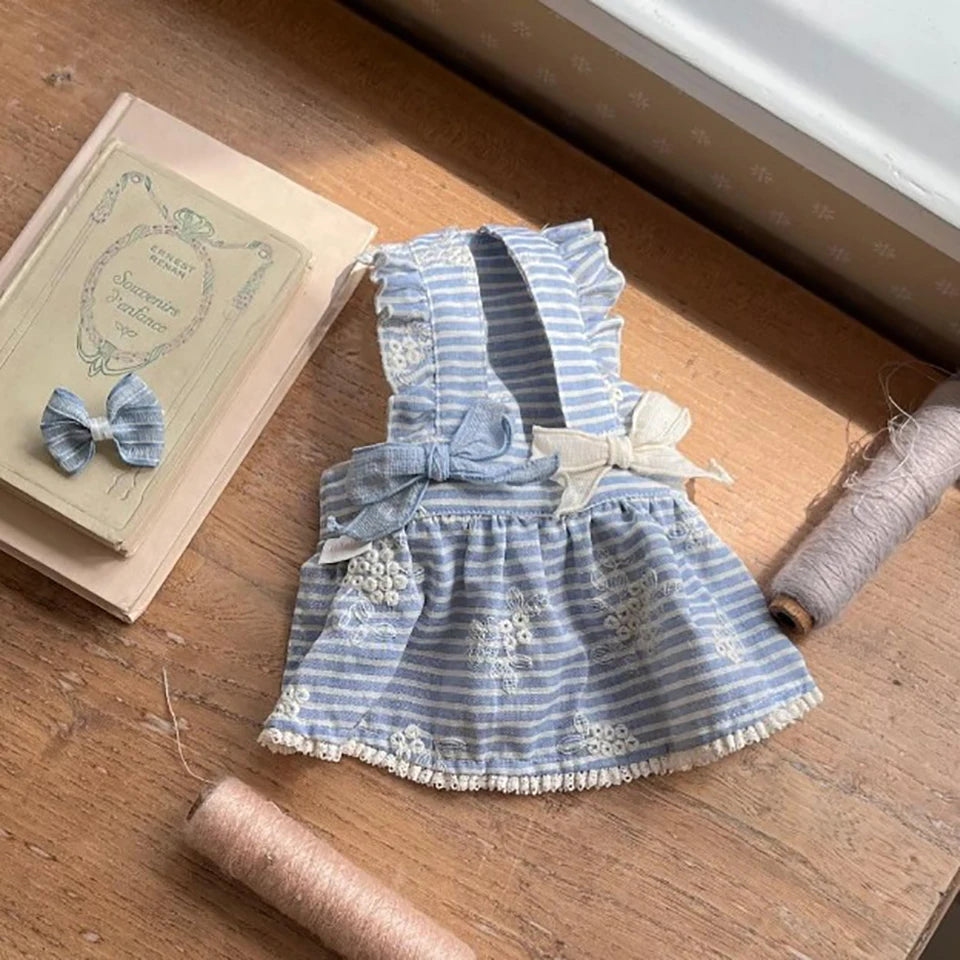 Cute blue and white striped dog dress with floral embroidery and bows for small to medium pets, perfect for spring.