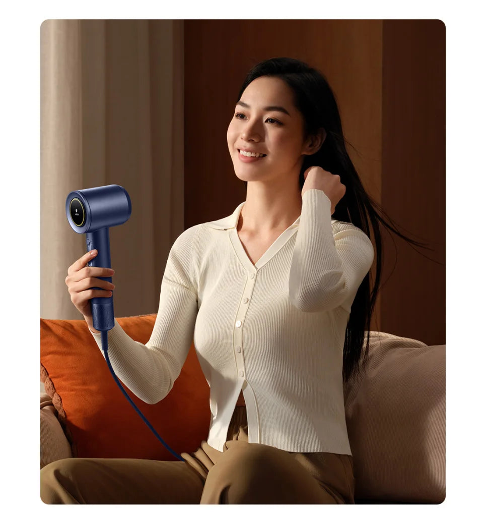 Woman holding a blue MIJIA high-speed water ion hair dryer for fast, quiet drying with smart temperature control.