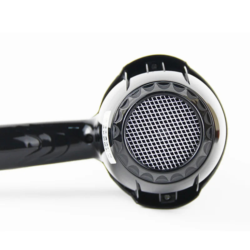 Black 2100W professional salon hair dryer, back view showing detailed airflow mesh filter and sleek ergonomic handle.