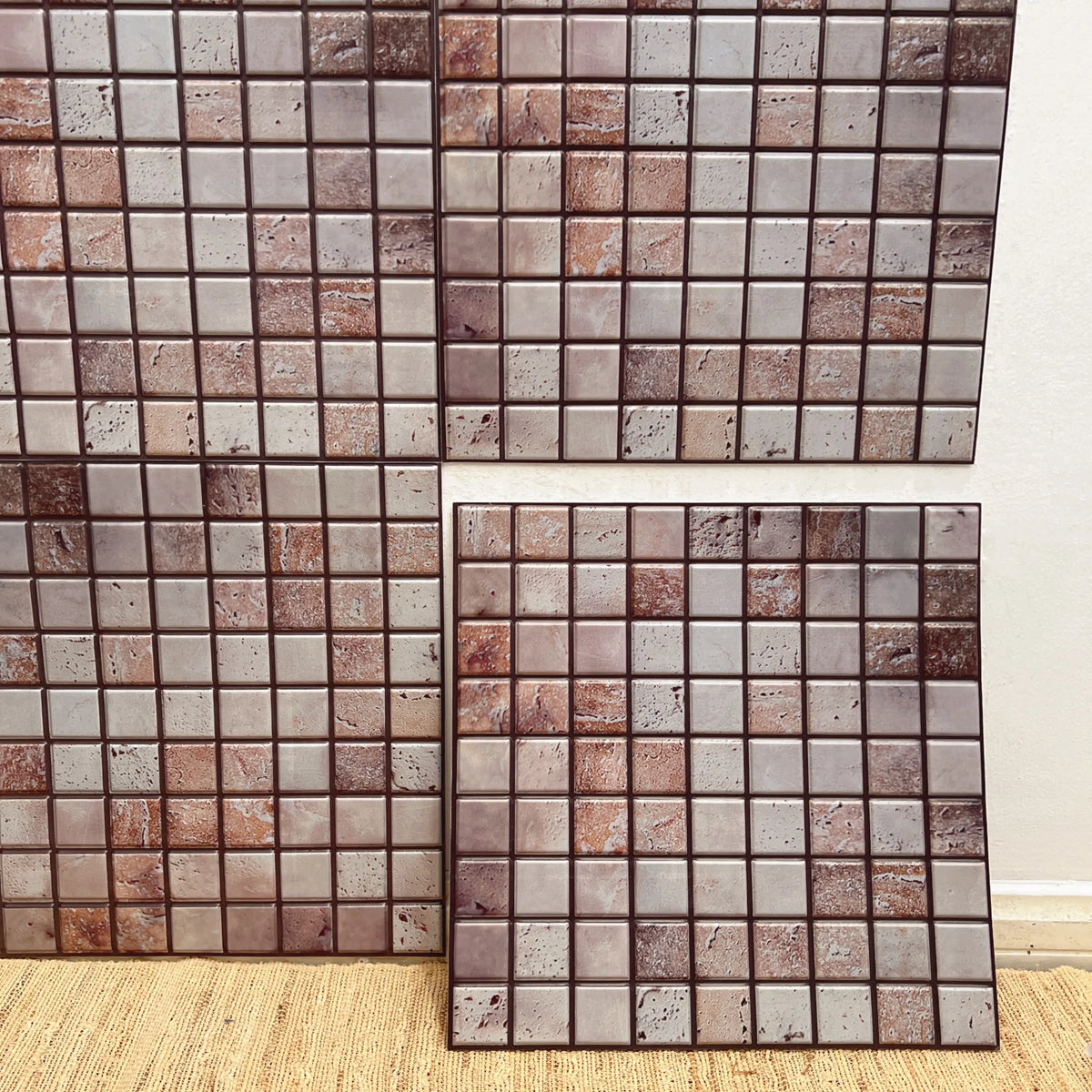 Peel-and-stick marble backsplash tiles, brown and cream square mosaic design