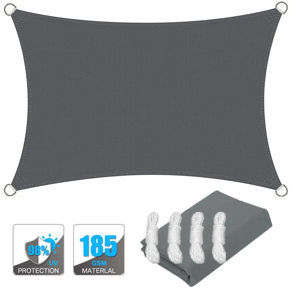 Dark gray rectangle sun shade sail canopy with corner grommets, plus included fabric bundle.