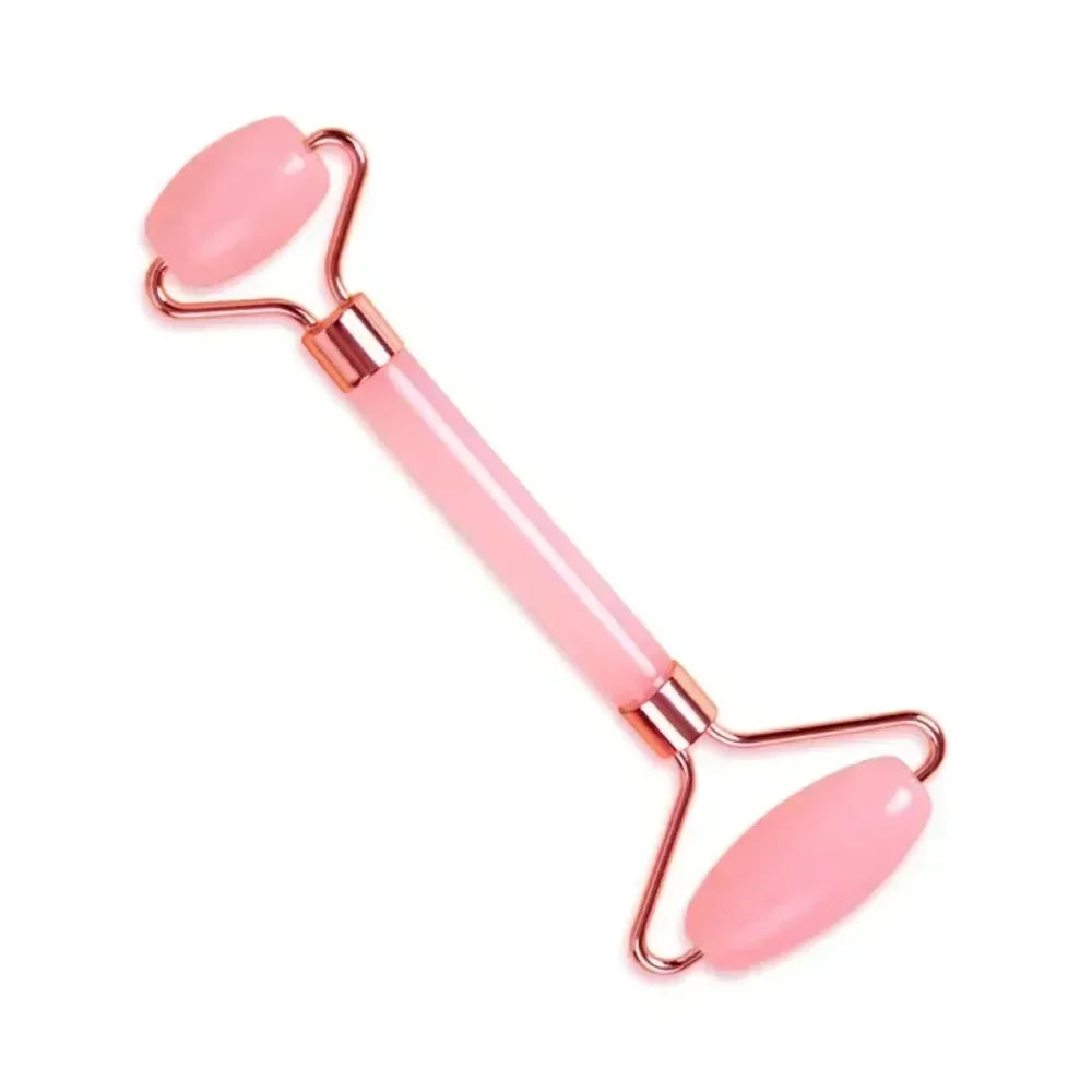 Pink resin dual-head facial jade roller for skincare, face lifting, anti-wrinkle massage, and anti-aging routines.