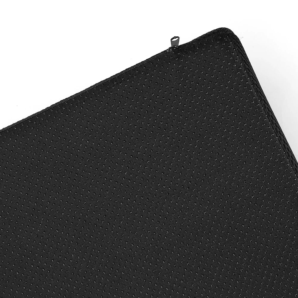 Black ergonomic under desk foot rest cushion with non-slip base and zipper detail for office or gaming chair support.