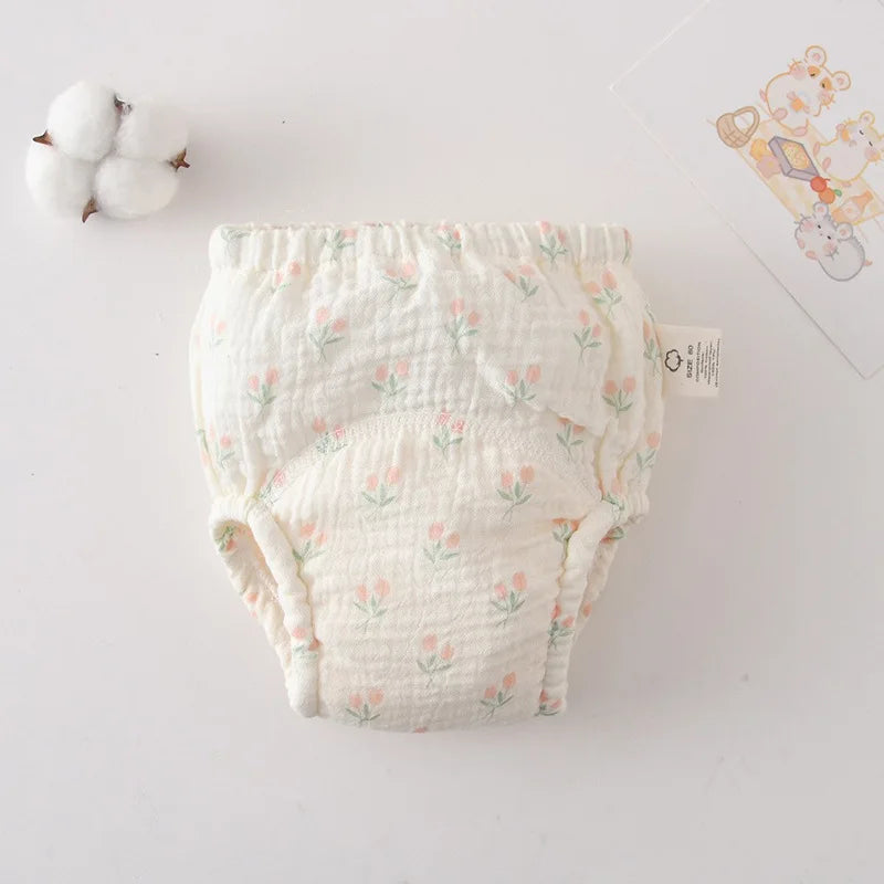 Baby training diaper in size 80, featuring a cute pink tulip floral print on soft muslin fabric for baby care.