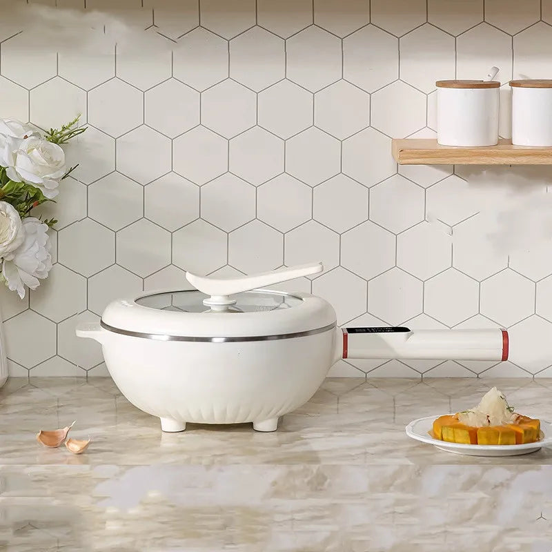 White electric cooking pot with domed lid, showing front controls and base legs