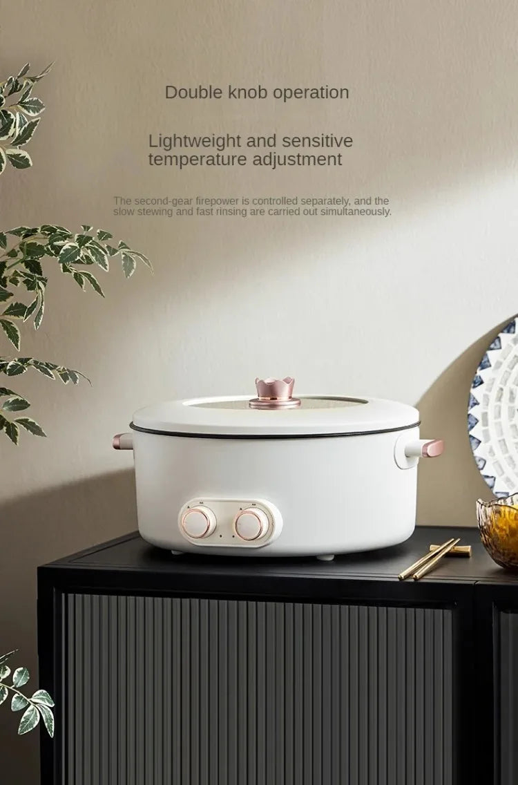 White 4-compartment electric hot pot with double knobs and domed lid on countertop