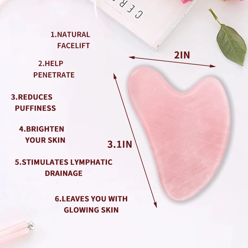 Pink heart-shaped rose quartz Gua Sha massage tool with labeled dimensions of 2 inches by 3.1 inches.