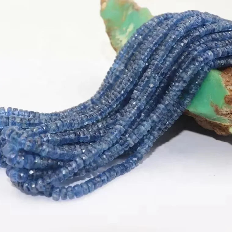 Kyanite rondelle bead strand with faceted blue beads, coiled loops and drilled holes