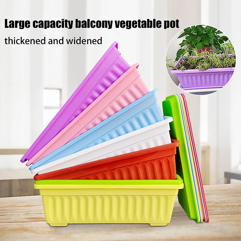Stacked colorful rectangular plastic vegetable planters with plants, including purple and orange