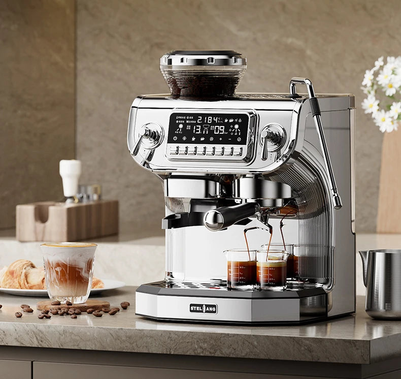 Stelang chrome espresso machine with integrated grinder, digital display, and dual portafilter brewing two shots.