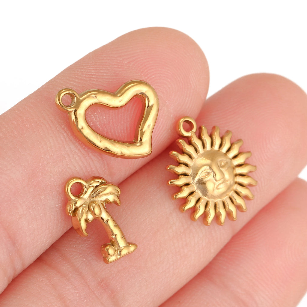 Gold-toned stainless steel heart, sun, and palm tree charms for DIY pet jewelry, necklaces, and bracelet making.